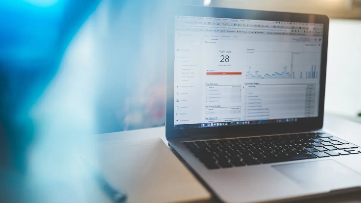 Marketing professional working on analytics and strategy at a laptop
