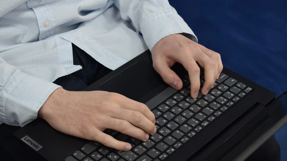 Person typing on a laptop keyboard while working on content strategy