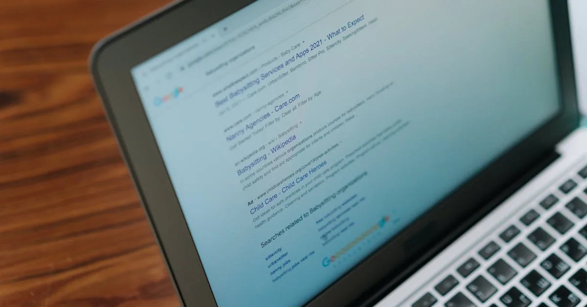 Person using Google search on a laptop to research information