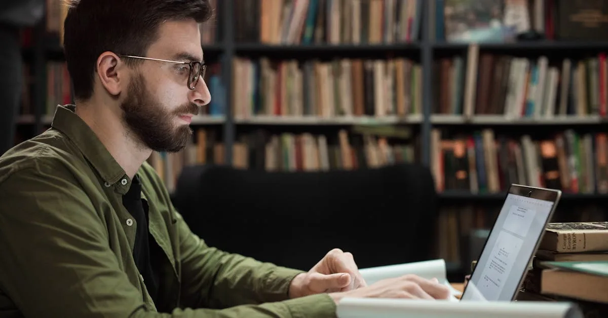 Person researching and typing on a laptop while reviewing answers